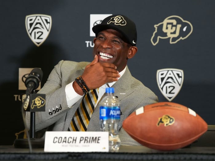 Deion Sanders smiles at his introductory presser at Colorado